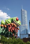 sculpture of a green frog on the background of the sky in Chicago