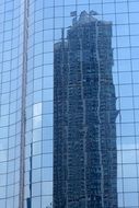 mirror facade of a skyscraper in Hong Kong