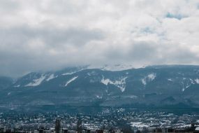 panorama of the city at the foot of the mountains