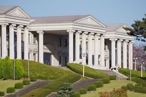 white building with amazing green lawn