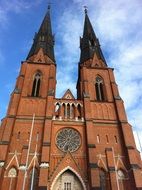 facade of the cathedral with spiers in the city of Uppsala