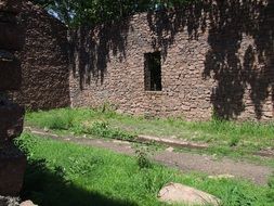 abandoned stone house in summer