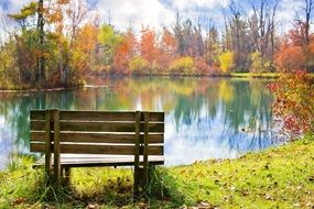 wooden bench near pond autumn fall season