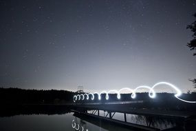 pier with light spiral effect at night