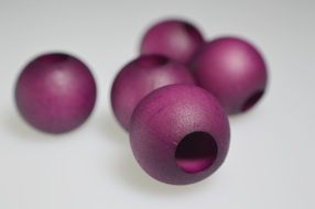 beads ball purple wood background