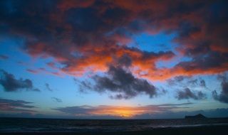sunrise clouds sky beach sea