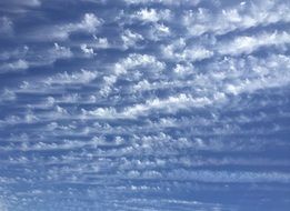 clouds in the sky are located in waves