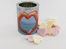 aluminum cans and candy in the form of hearts