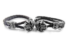 two bracelets with images of skulls