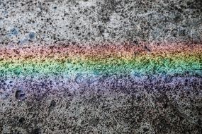 painted rainbow on concrete