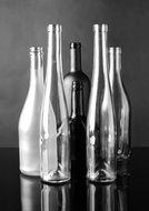 black and white still life with empty bottles