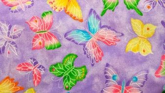 purple fabric with colorful butterflies