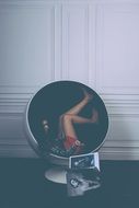 posing model girl in the armchair