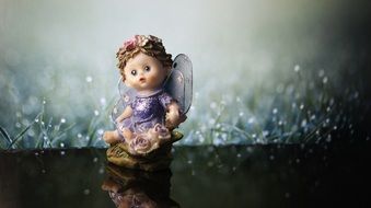 angel figure reflection background