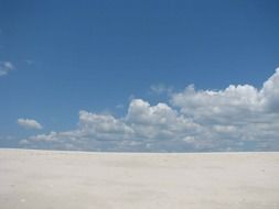 sand sky outside clouds