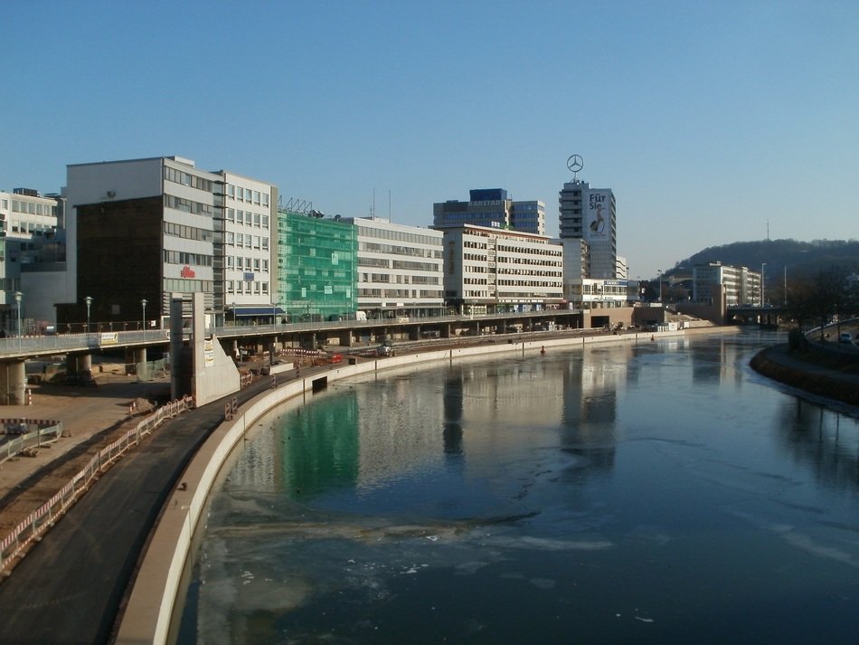 Berlin's buildings reflected in the frozen water