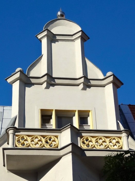 pediment of a building against a clear blue sky