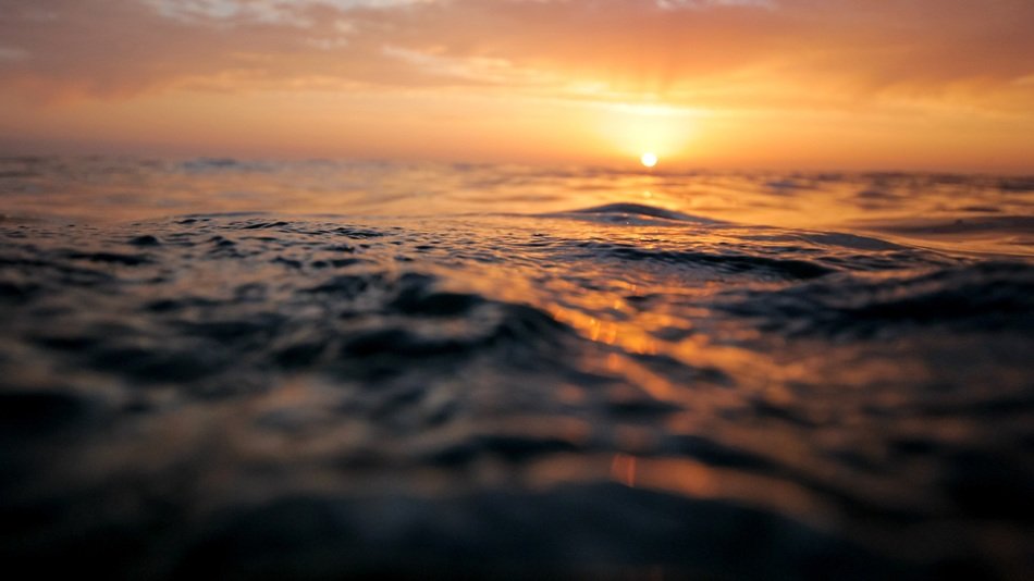 ocean surface sunset waves sea