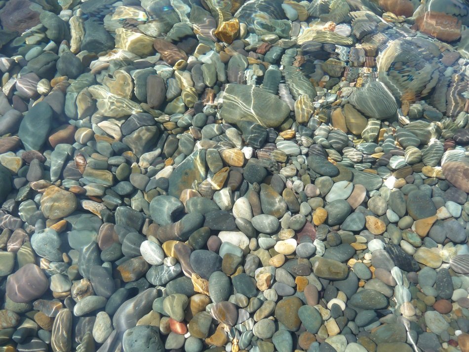 pebbles rocks gravel ocean sea