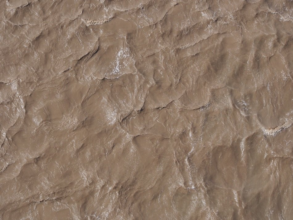 water brown silt ripples waves