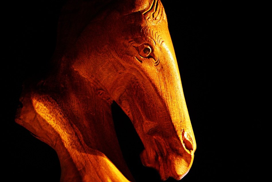 horse statue wood background black