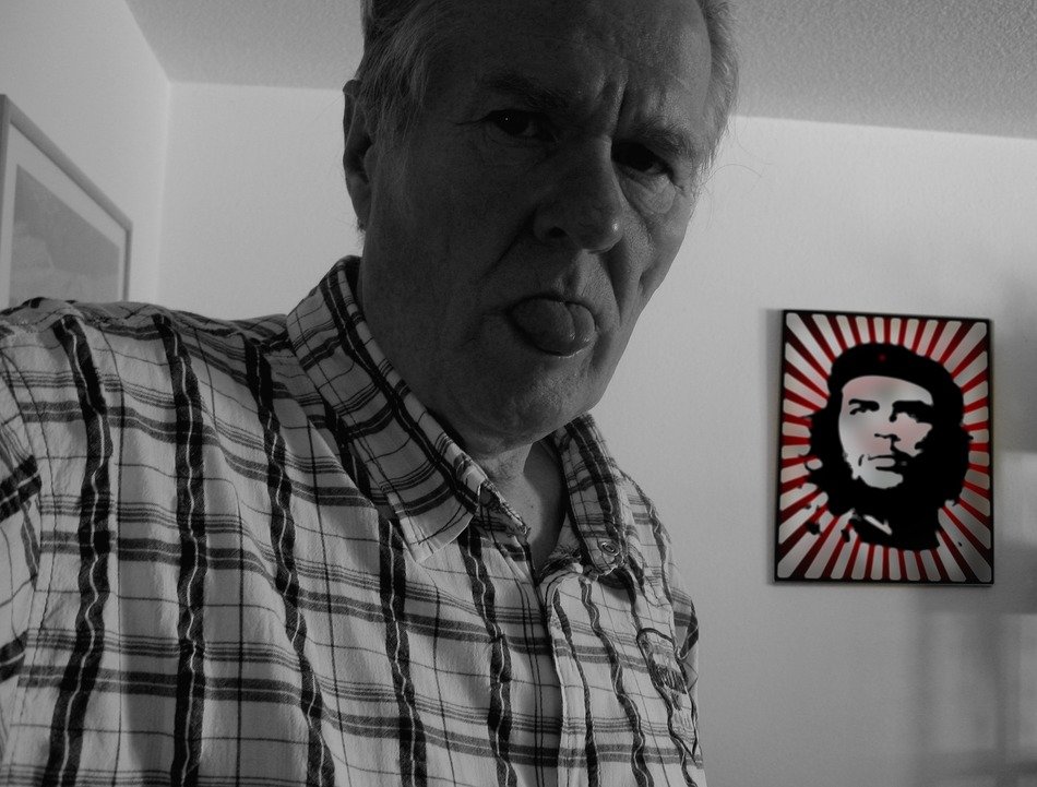 man face old pensioners tongue