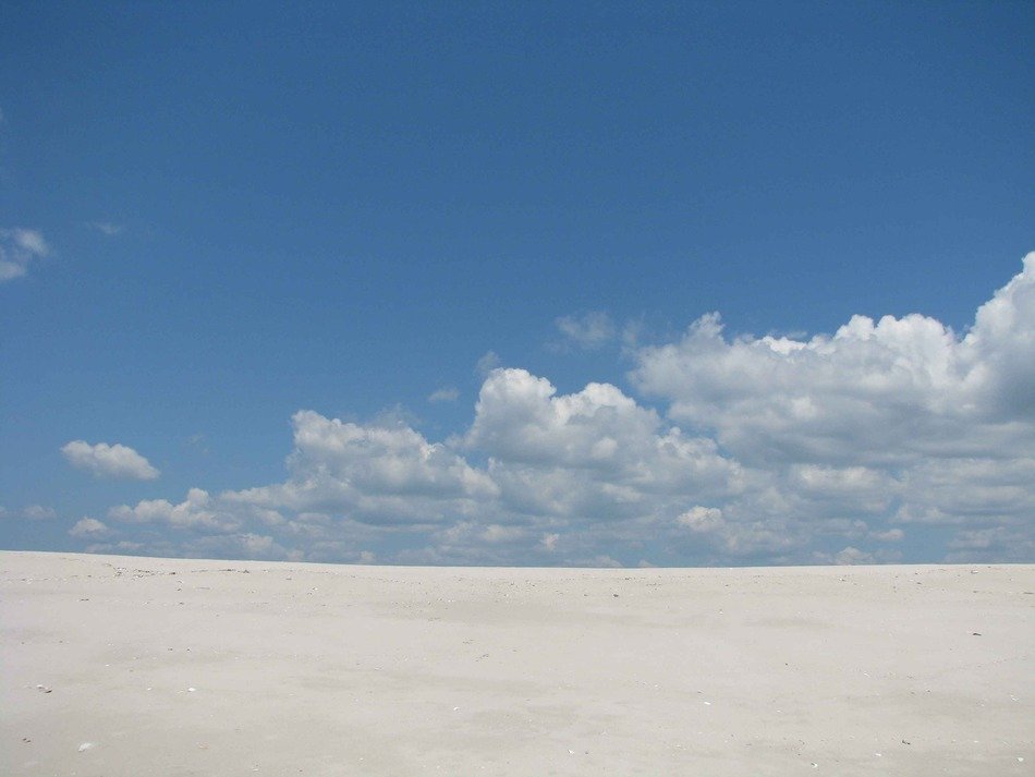 sand sky outside clouds