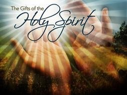 hands in the sunlight on the inscription "Holy Spirit"