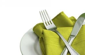 Metal fork and knife on the towel