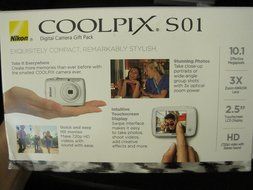 Nikon COOLPIX S01 10.1 MP Digital Camera with 3x Zoom NIKKOR Glass Lens (Silver) with Exclusive Clutch