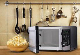 Westinghouse WM009 900 Watt Counter Top Microwave Oven, 0.9 Cubic Feet, Stainless Steel Front with Black Cabinet N2