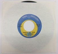 NOS LOU CHRISTIE " SADDLE THE WIND" "BEYOND THE BLUE HORIZON" 45 RPM RECORD