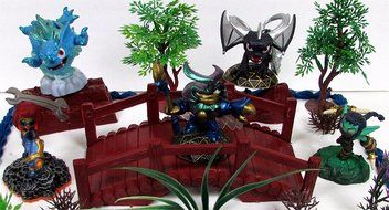 SKYLANDERS 12 Piece Birthday Cake Topper Set Featuring 5 Random Skylander Figures and Themed Decorative Accessories... N7