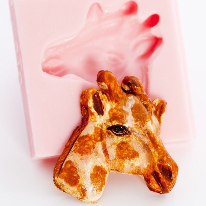 Giraffe Head Silicone Mold Chocolate, Fondant, Candy, Mints, Resin, Clay. Mold creates a small flat backed giraffe...