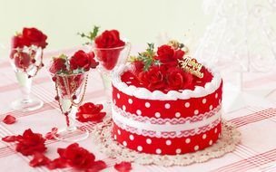 Happy New Year, beautiful cake and red roses in wine glasses on table