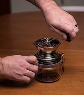 Gourmet Hand Powered Chrome Coffee Grinder with Latch Secured Canister