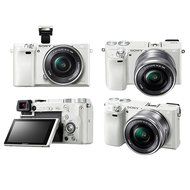 Sony Alpha a6000 Mirrorless Camera (White) w/ 16-50mm &amp; 55-210mm Lens (Silver) and 64GB SD Card Bundle N3