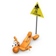 figurine of a man near a road sign