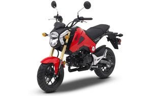 photo of a red-black motorcycle