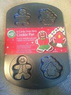 Wilton 6 Cavity Non-Stick Cookie Pan ... gingerbread man, gingerbread house