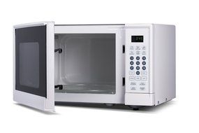 Westinghouse WM009 900 Watt Counter Top Microwave Oven, 0.9 Cubic Feet, Stainless Steel Front with Black Cabinet N4