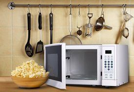 Westinghouse WM009 900 Watt Counter Top Microwave Oven, 0.9 Cubic Feet, Stainless Steel Front with Black Cabinet N6