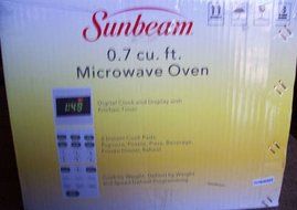 Sunbeam 0.7 cu. ft. 700 Watt Digital Display Compact Countertop Microwave Oven (SGT1701)