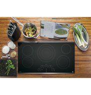 GE Profile 36" Touch Control Black Glass Cooktop with Stainless Steel Trim N6