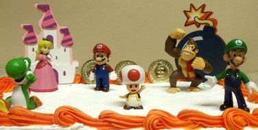 Mario Brothers 23 Piece Birthday Cake Topper Set Featuring Mario Castle, Bomb, Mario Coins, 6 Mario Figures Including... N8
