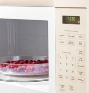 GE MICROWAVES 1029481 1000W 1.6 cu. ft. Over-The-Ran Microwave Oven, Bisque