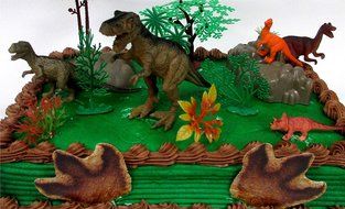 Prehistoric T-Rex DINOSAUR 12 Piece Birthday CAKE Topper Set Featuring a T-Rex and 4 Random Dinosaur Figures,... N5