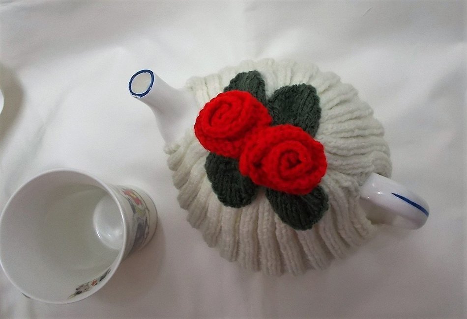 Hand knitted Cream tea cosy with red flowers fits a 4 - 6 cup tea pot N2