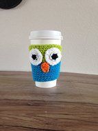 Crochet owl cup cozy in lime green and bright blue. N3