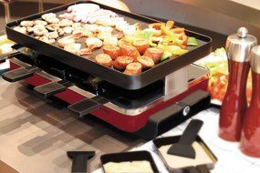 Swissmar KF-77040 Classic 8-Person Raclette Party Grill with Reversible Cast Iron Grill Plate/ Crepe Top, Black N3